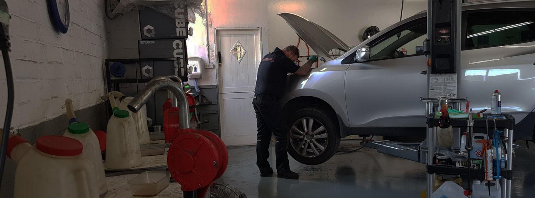 Staff working under bonnet